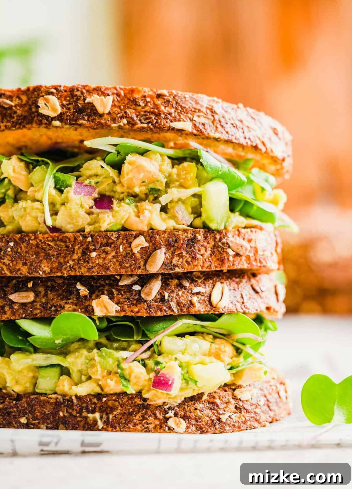 Easy Vegan Smashed Chickpea Sandwich Recipe Two perfectly stacked smashed chickpea sandwiches, ready to be enjoyed as a wholesome and delicious vegan meal.