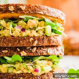 Two stacked smashed chickpea sandwiches, showcasing the wholesome filling and perfect toast.