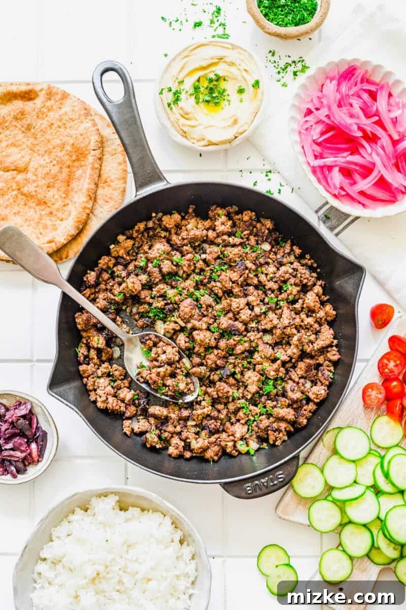 Levantine Spiced Beef Bowls 3 A large skillet filled with perfectly cooked, richly spiced ground beef, ready to be served.