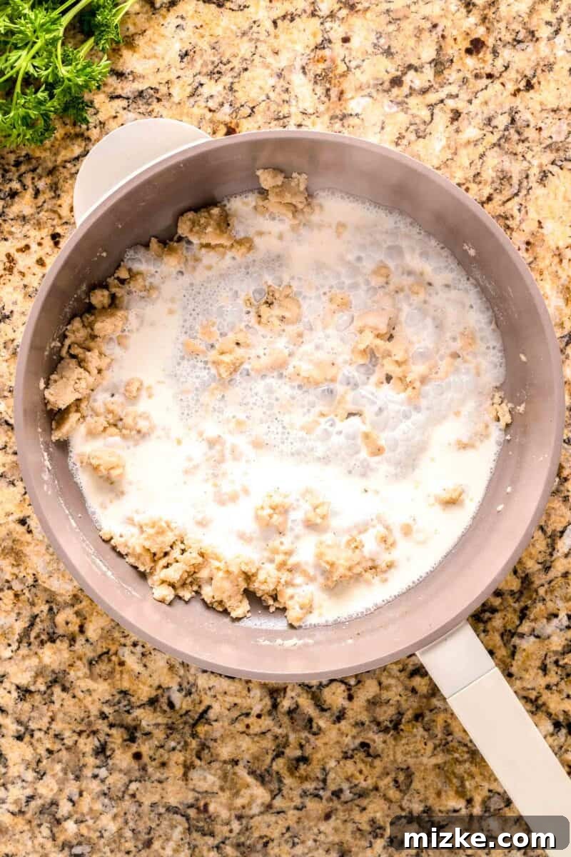 Creamy Garlic Parmesan Chicken Pasta 7 garlic paste mixture with heavy cream in a nonstick pot