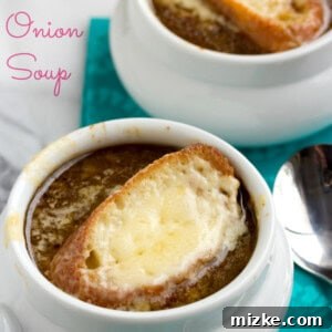 Classic French Onion Soup ready to serve in an oven-safe bowl with melted Gruyère cheese