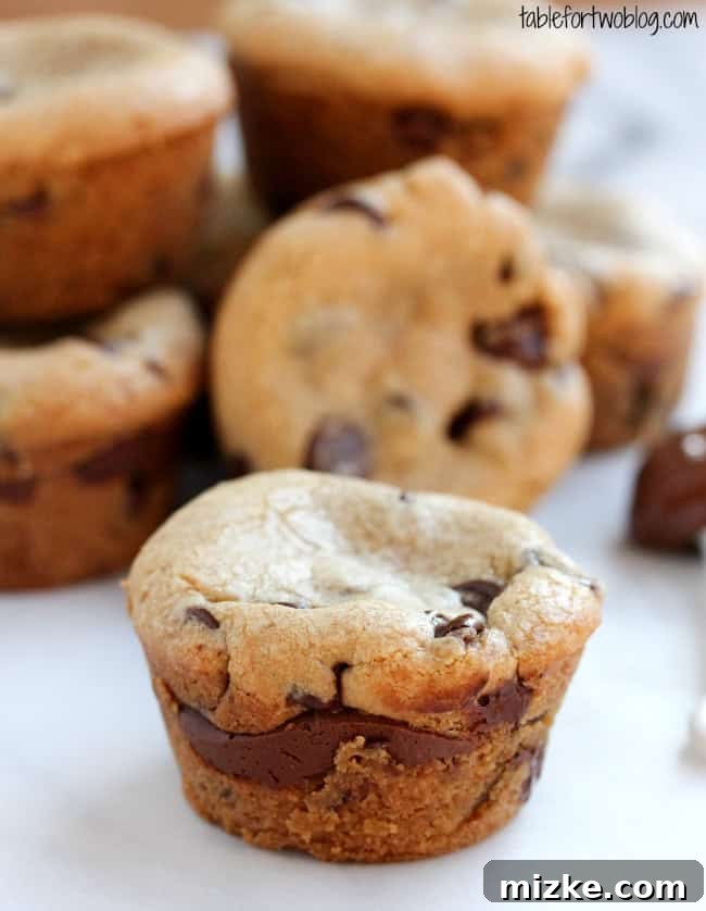 Nutella Lava Cookie Cups via tablefortwoblog.com Close-up of a Nutella Lava Cookie Cup, revealing its molten Nutella core