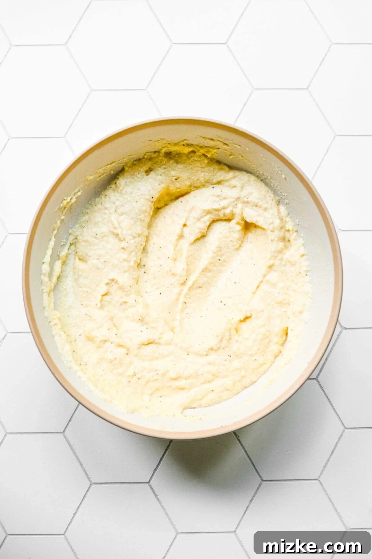 Smooth and ready ricotta cheese filling A mixing bowl filled with ricotta filling, perfectly mixed and smooth