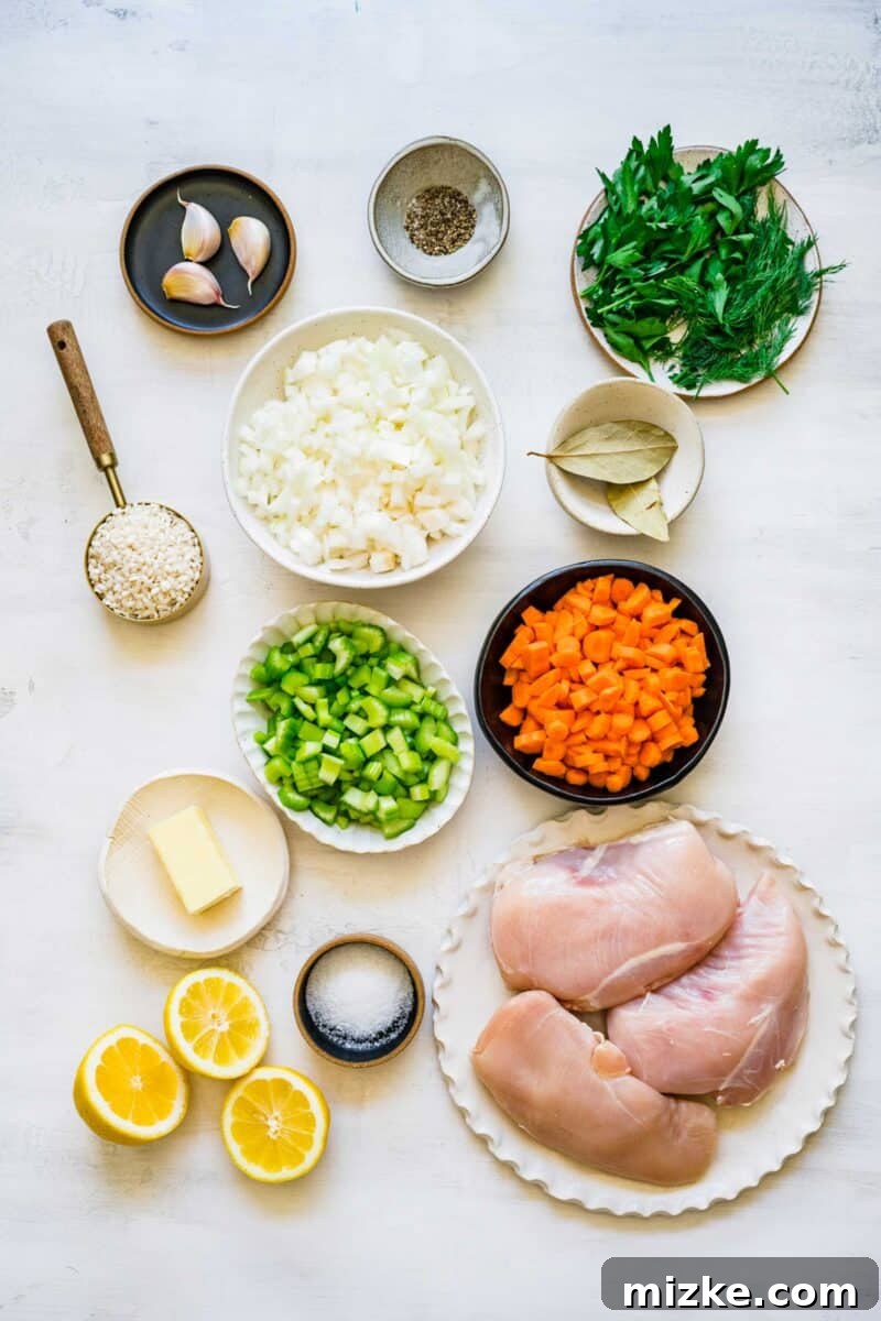 Zesty Lemon Chicken Rice Soup 4 Top-down view of fresh, vibrant ingredients laid out on a wooden surface, ready for making lemon chicken rice soup, including chicken, chopped vegetables, lemons, and herbs