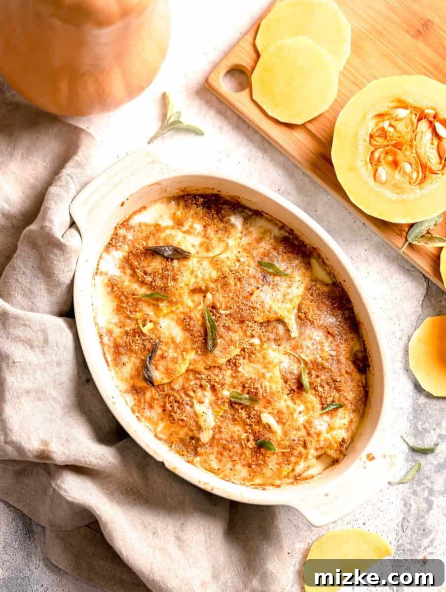 Golden Butternut Bake 2 overhead shot of butternut squash gratin out of the oven with uncooked butternut squash on a cutting board.