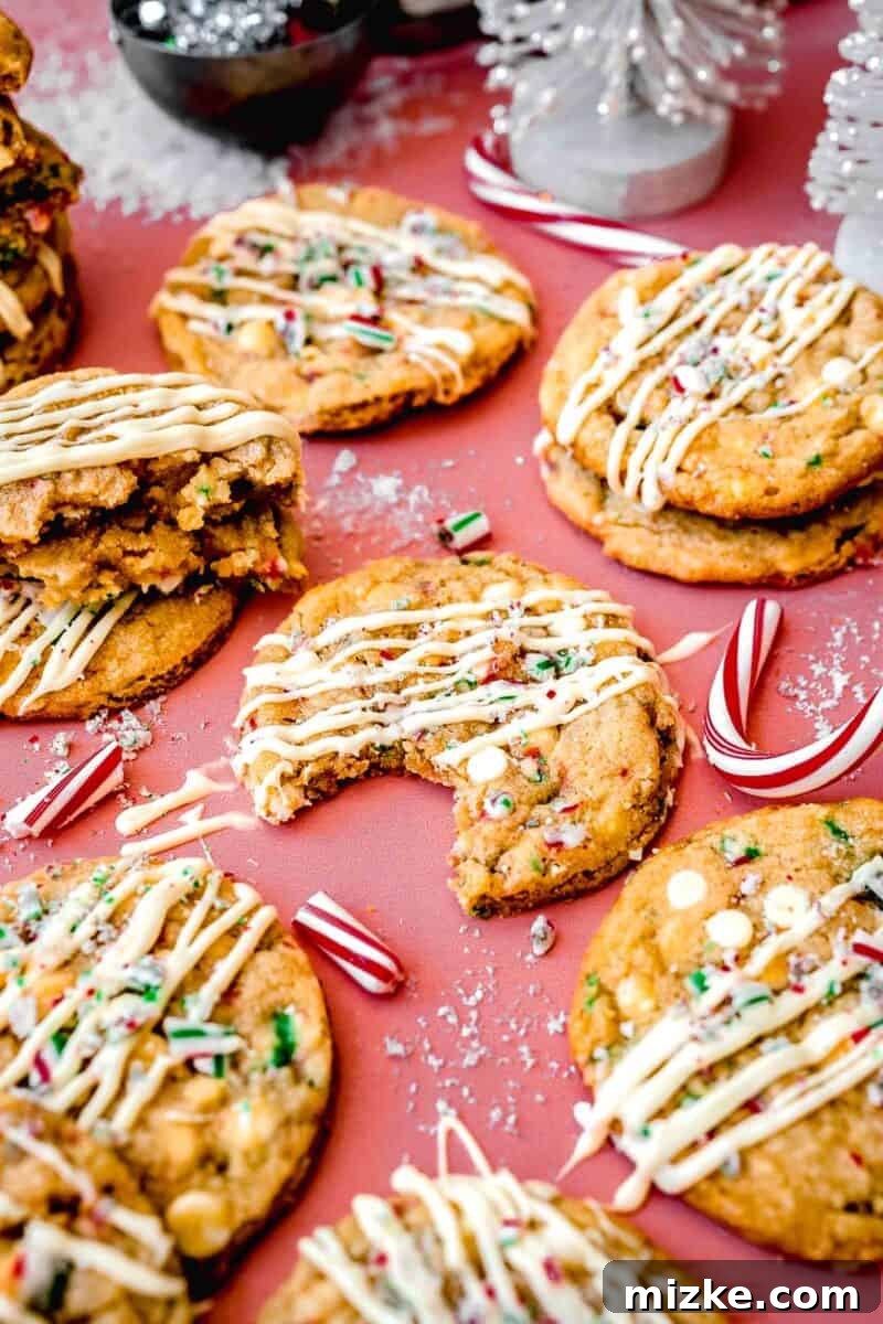 White Chocolate Peppermint Bliss Cookies 9 a bite taken out of a peppermint white chocolate cookie
