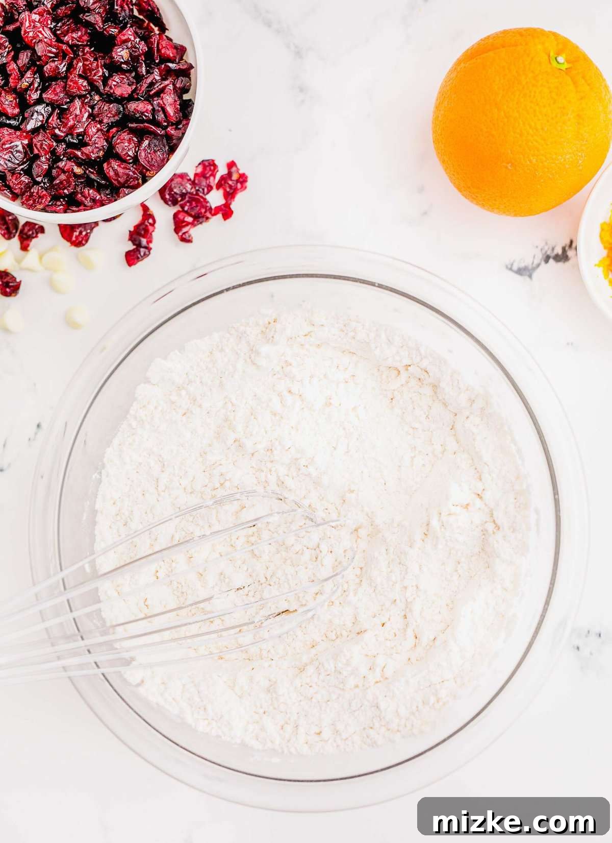 Golden Orange Cranberry Shortbread Delights 6 Whisking together the dry ingredients in a bowl.