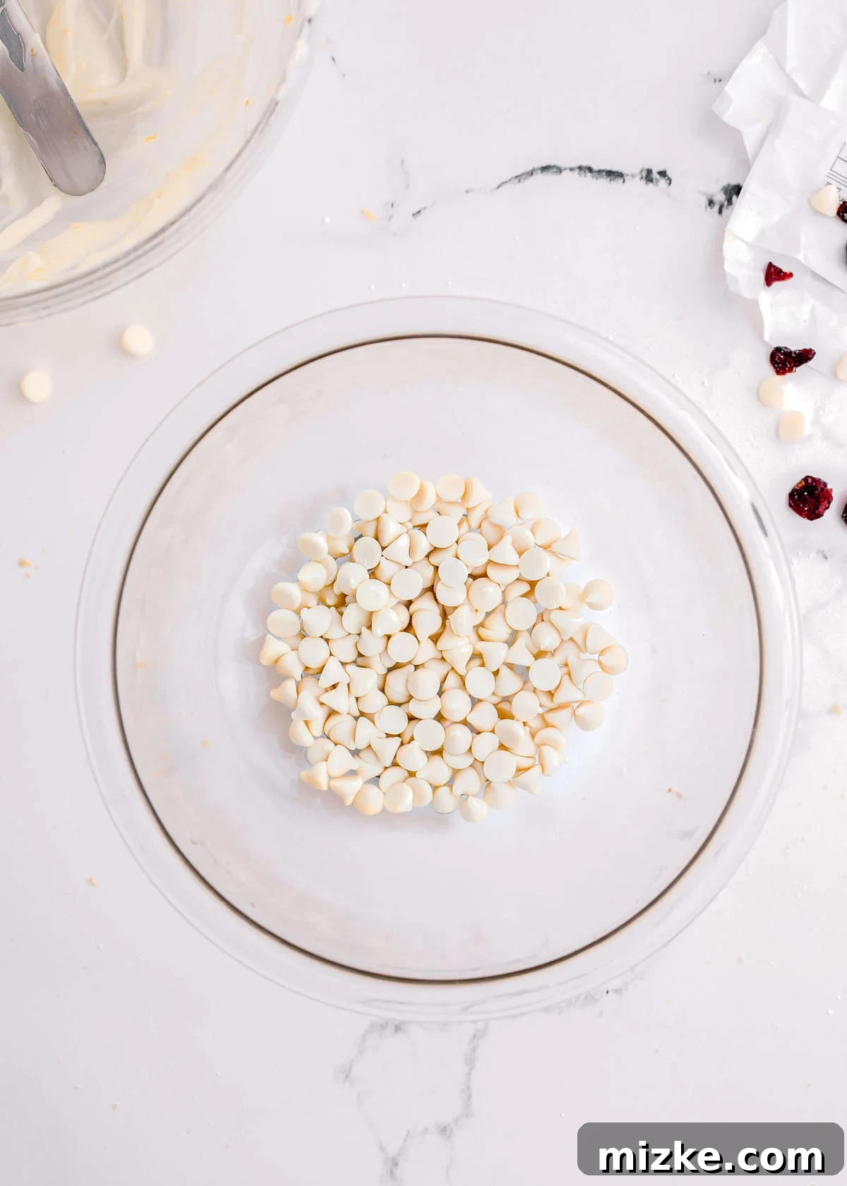 Bake Your Own Cranberry Bliss 16 White chocolate chips in a clear glass bowl, ready for melting.