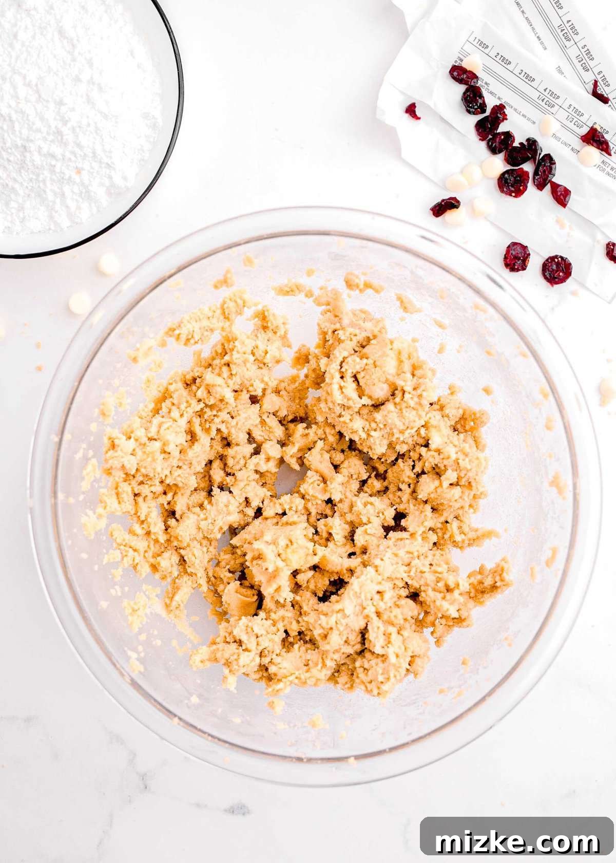 Bake Your Own Cranberry Bliss 7 Creaming together butter, brown sugar, and eggs in a bowl until light and fluffy.