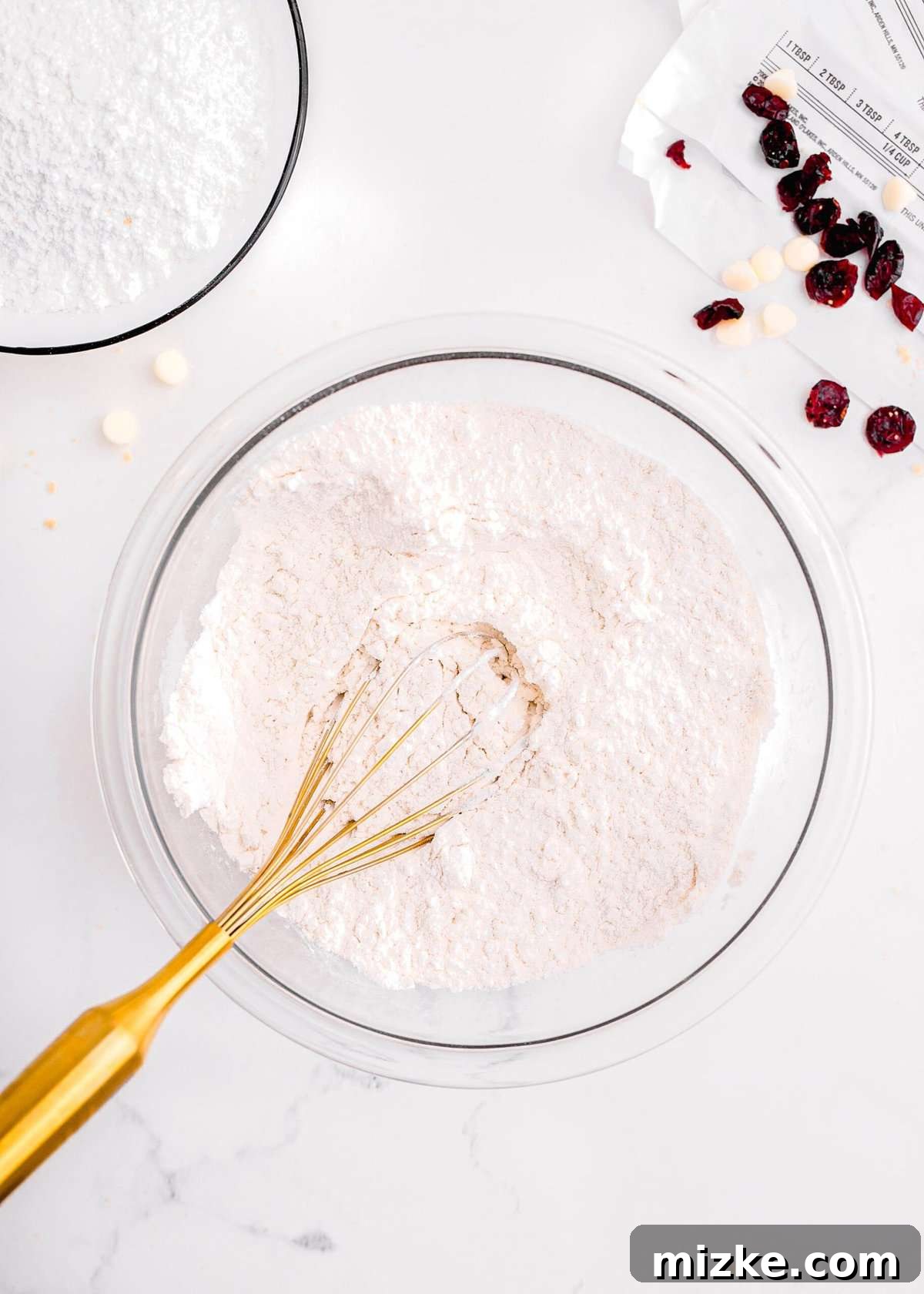 Bake Your Own Cranberry Bliss 8 Whisking together dry ingredients: flour, cornstarch, baking powder, and salt in a separate bowl.