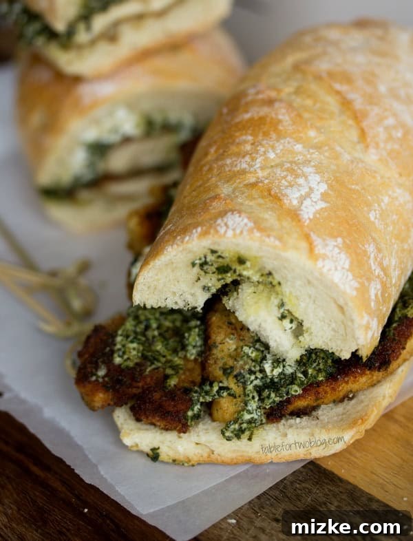 Goat Cheese Pesto Chicken Sandwich from www.tablefortwoblog.com Three Goat Cheese Pesto Chicken Sandwiches arranged artfully, ready to be served.