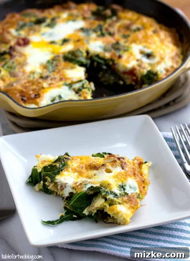 This healthy vegetable frittata recipe is an easy, high-protein breakfast filled with ground turkey, kale, onions, and sun-dried tomatoes. A slice of turkey and vegetable frittata on a square plate, next to a full frittata in a cast iron skillet.
