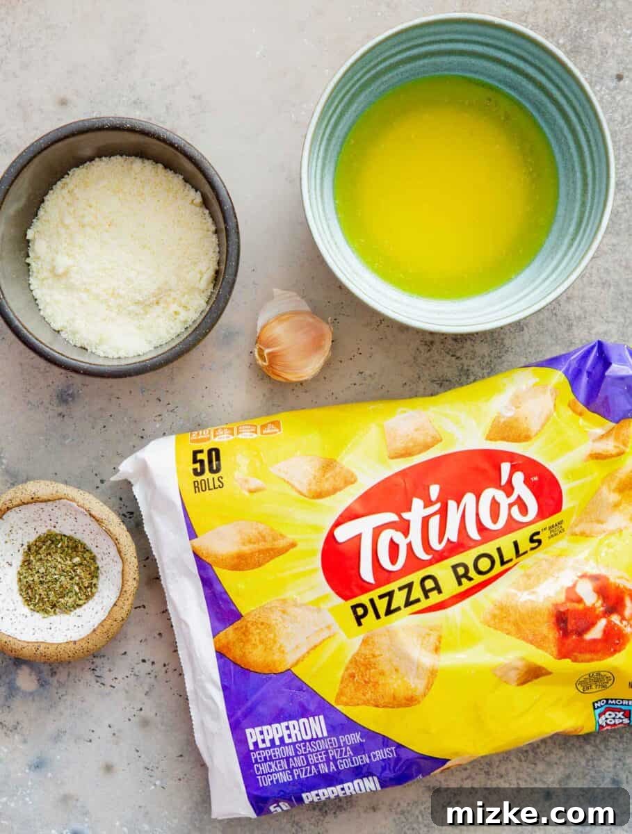 Snackable Pizza Bites 4 Key ingredients for garlic parmesan pizza rolls: frozen pizza rolls, melted butter, grated parmesan cheese, fresh minced garlic, and Italian seasoning, neatly arranged on a white surface.