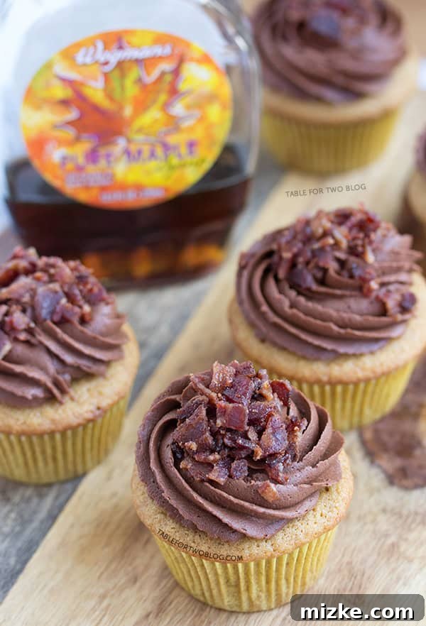Maple Bacon Cupcakes from www.tablefortwoblog.com Close-up of a frosted Maple Bacon Cupcake, showcasing the texture