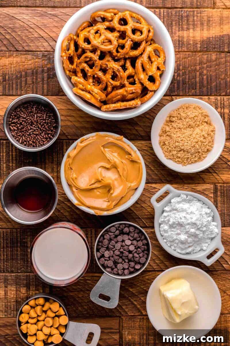 Ingredients laid out for peanut butter pretzel bites: mini pretzels, brown sugar, powdered sugar, butter, butterscotch and chocolate chip morsels, heavy cream, vanilla extract, and creamy peanut butter