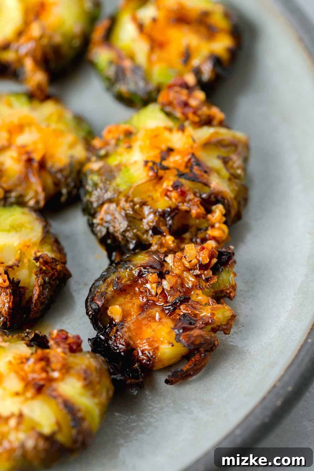 Perfectly Crisped Air Fryer Smashed Brussels Sprouts 6 Crispy smashed Brussels sprouts drizzled with vibrant garlic chili crisp oil