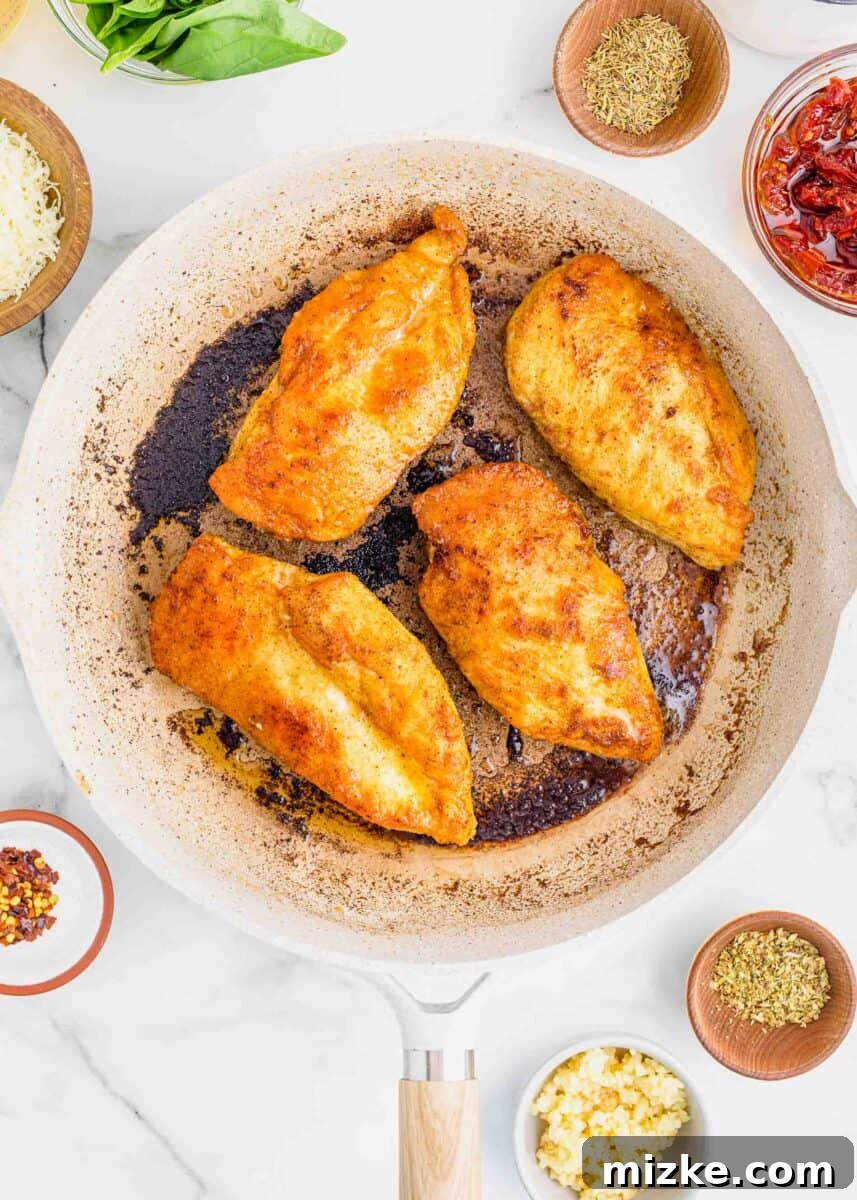 Yes-I-Will Chicken 6 Seared chicken breasts in a nonstick skillet, ingredients for sauce in small bowls nearby