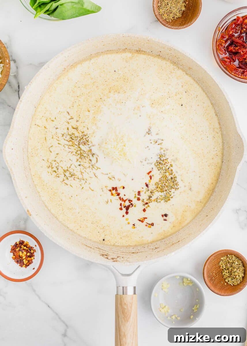 Yes-I-Will Chicken 7 Ingredients for creamy sauce simmering in a nonstick skillet