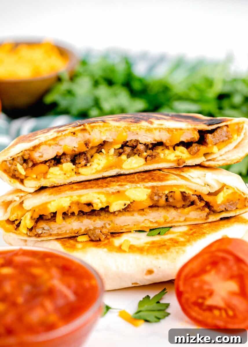 Sunrise Crunch Fold 12 A tempting stack of freshly prepared breakfast crunchwraps is arranged beside a bowl of vibrant salsa, inviting you to dig in.