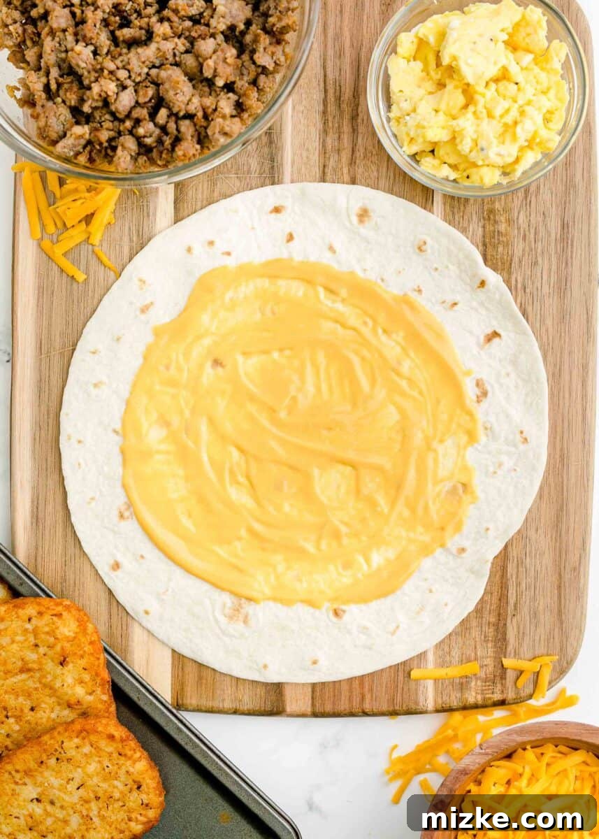 Sunrise Crunch Fold 6 A perfect circle of rich nacho cheese is spread evenly in the center of a large flour tortilla, ready for layering.