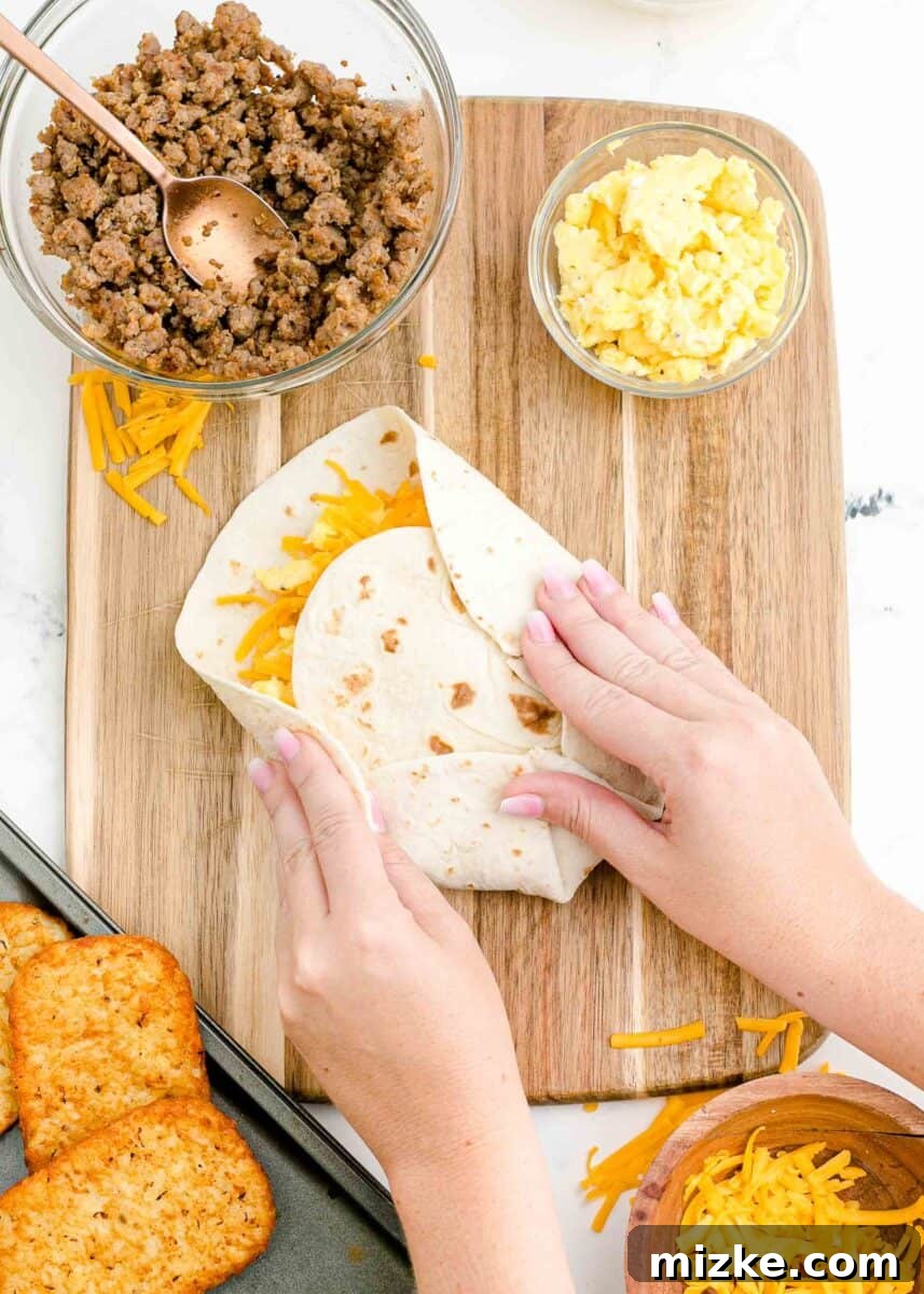 Sunrise Crunch Fold 10 A smaller tortilla is carefully placed on top of the layered fillings, ready to be wrapped by the larger tortilla edges.