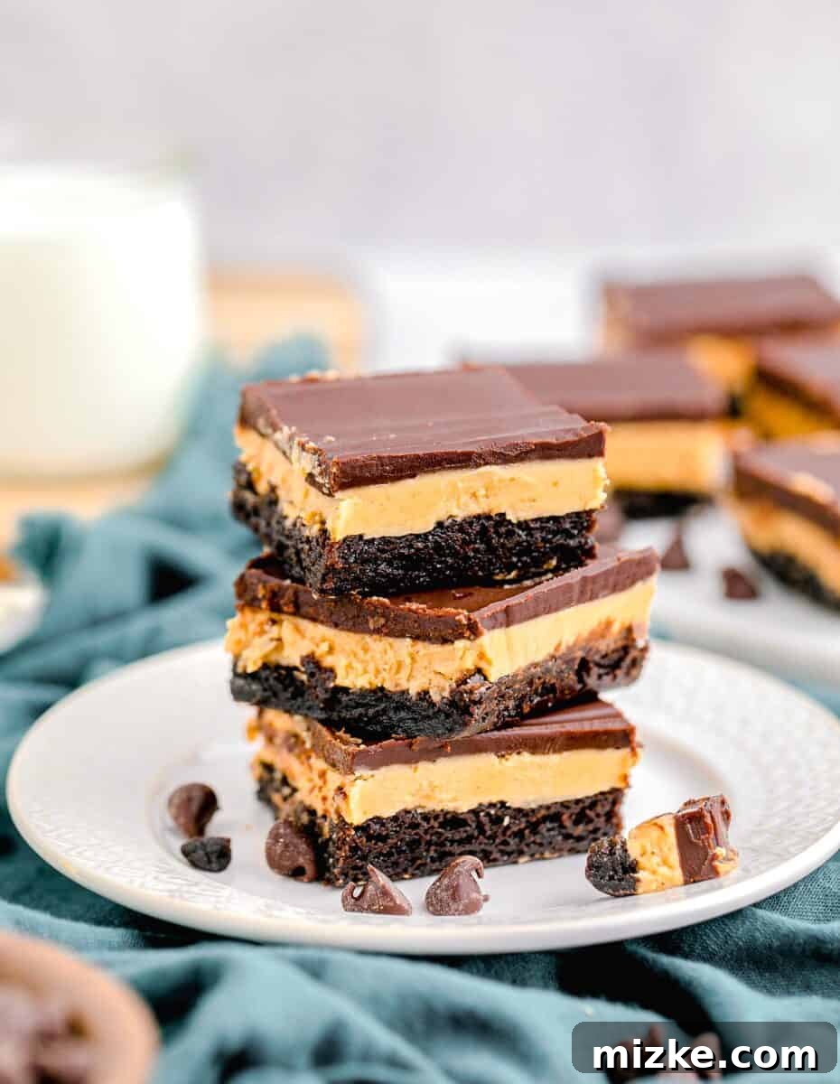 Buckeye Bliss Brownies 2 three brownies are stacked on a white plate