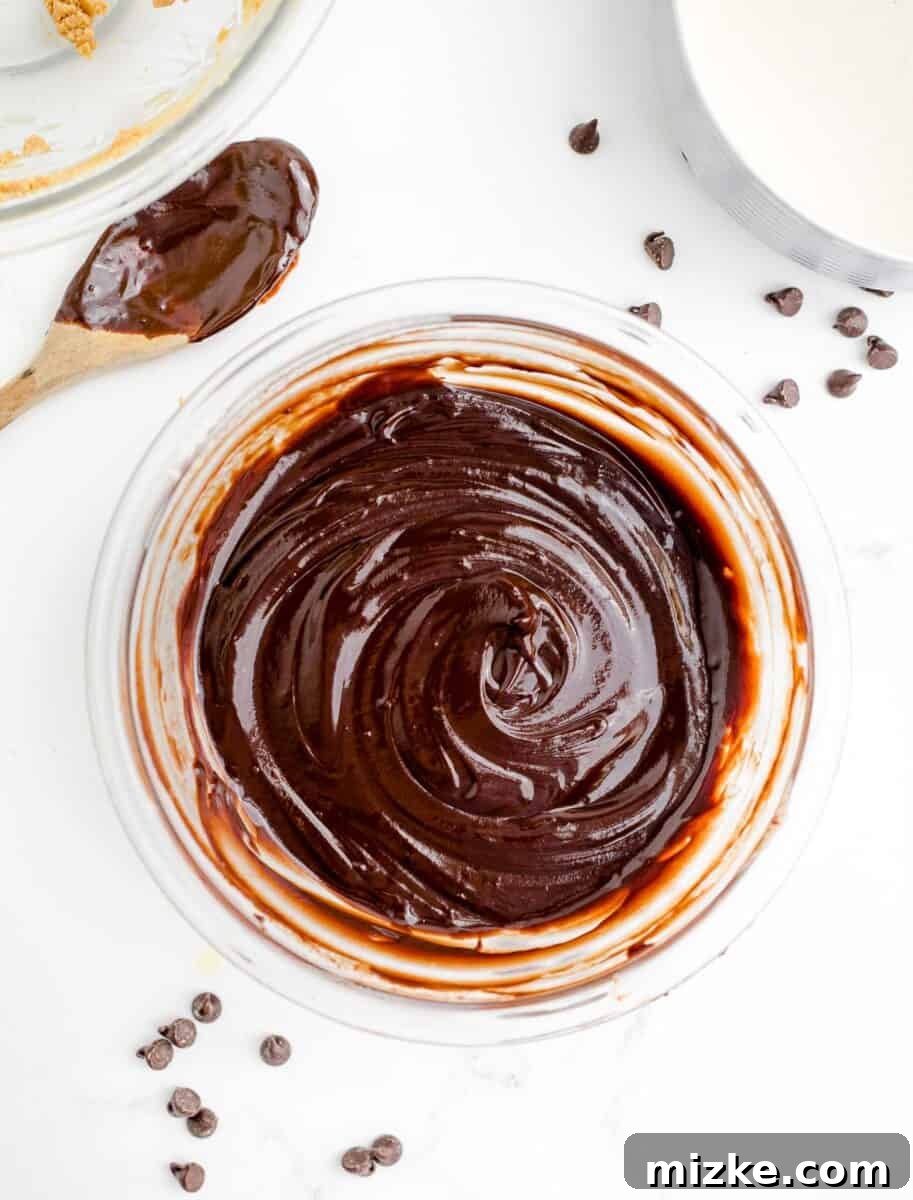 Buckeye Bliss Brownies 9 a chocolate mixture has been stirred in a glass mixing bowl