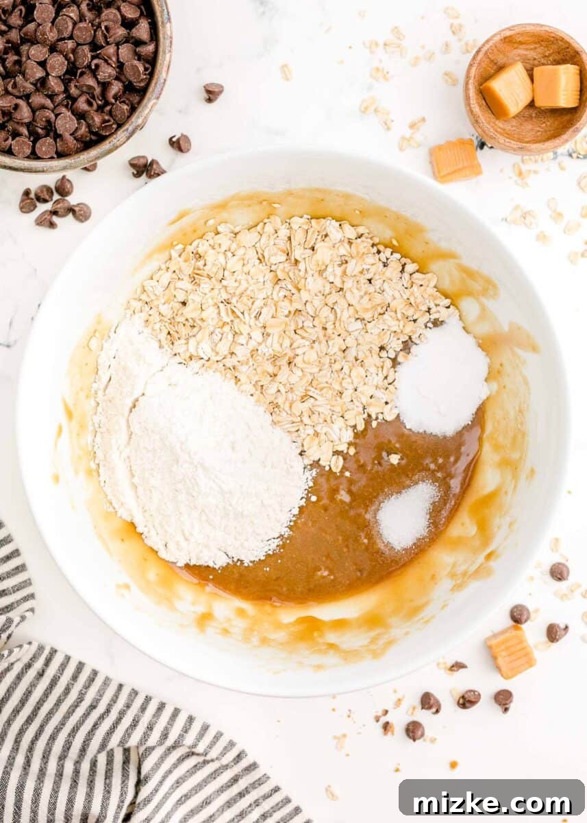 The Carmelitas Legacy 4 Butter, brown sugar, and vanilla extract are measured into a clear glass mixing bowl.