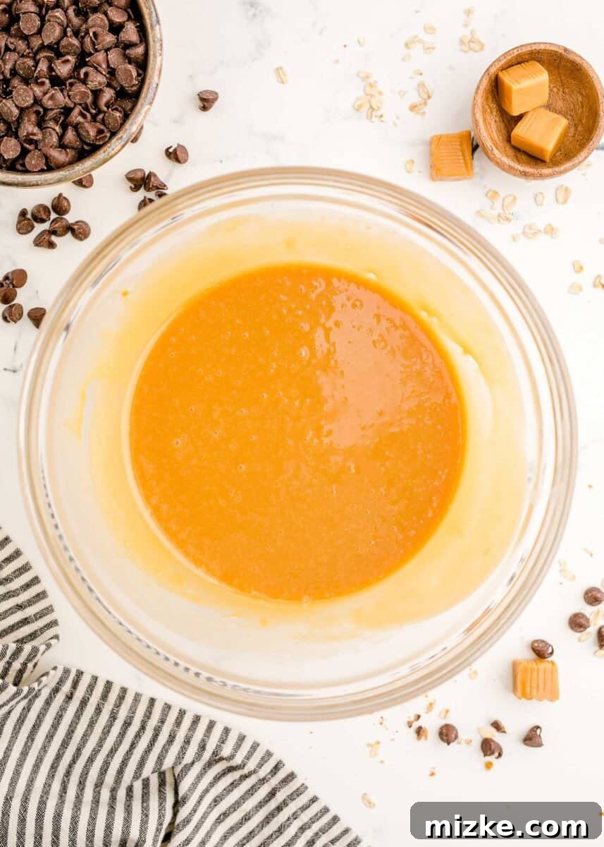 The Carmelitas Legacy 7 The caramel sauce is now smooth and glossy in a glass bowl after being melted and stirred.