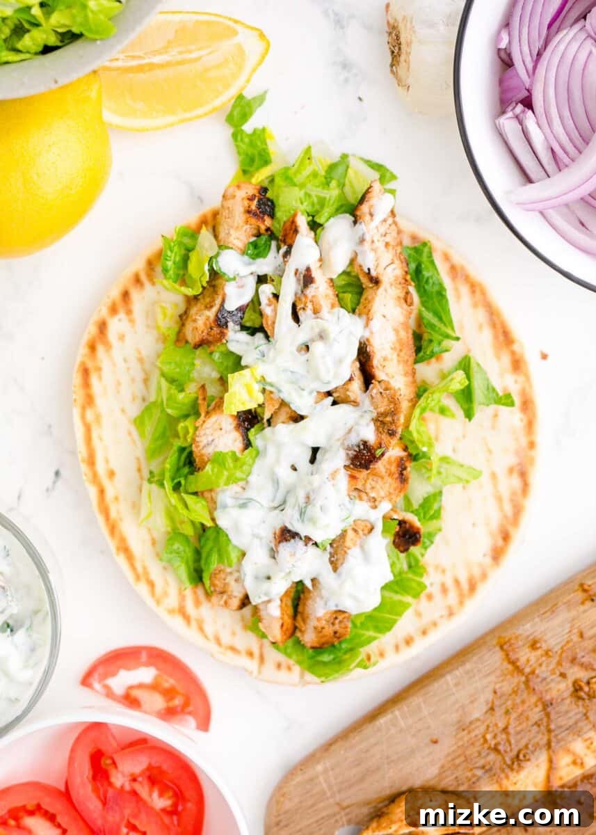 Mediterranean Chicken Wraps 10 lettuce, chicken, and tzatziki are placed on an open gyro.