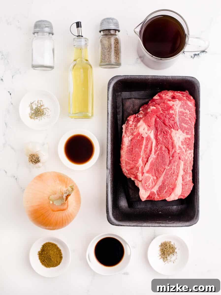 Effortless Slow Cooker French Dip Perfection 3 A vibrant array of fresh ingredients for French Dip sandwiches meticulously arranged on a clean white surface, showcasing the quality of the components.