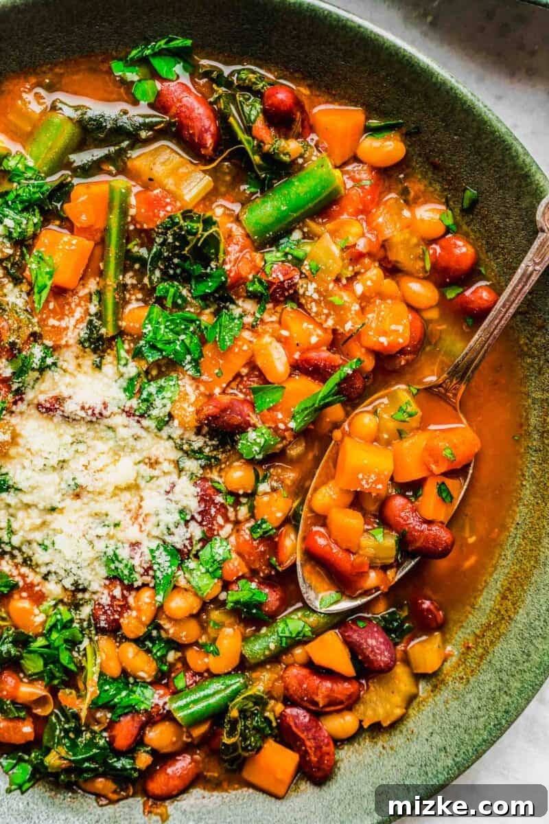 A beautiful close-up reveals the rich colors and textures of the beans and vegetables within the Instant Pot soup.