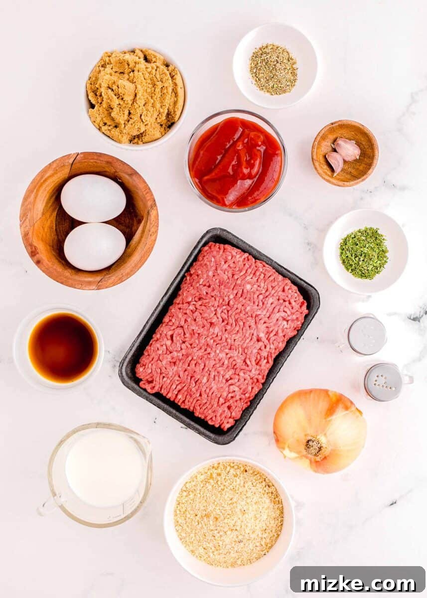 Perfect Instant Pot Meatloaf 3 All the fresh ingredients required for making a delicious Instant Pot meatloaf are neatly arranged on a white kitchen surface, showcasing vibrant colors and textures from ground beef to herbs and spices.