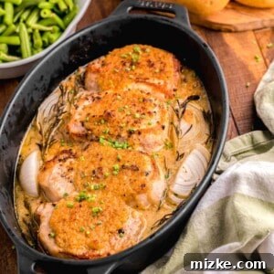 A tea towel is placed next to a pot filled with cooked pork chops.