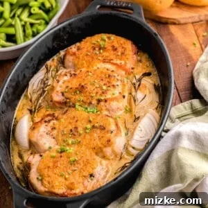 A tea towel is placed next to a pot filled with cooked pork chops.