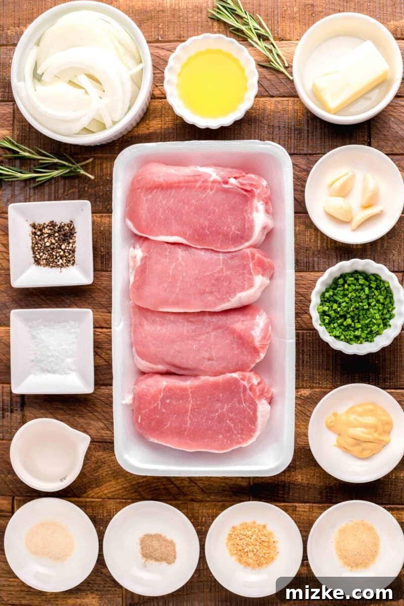 Flavorful Oven Roasted Pork Chops 3 A vibrant spread of fresh ingredients for oven roasted pork chops, including thick-cut chops, onions, garlic, and rosemary, arranged artfully on a wooden cutting board.