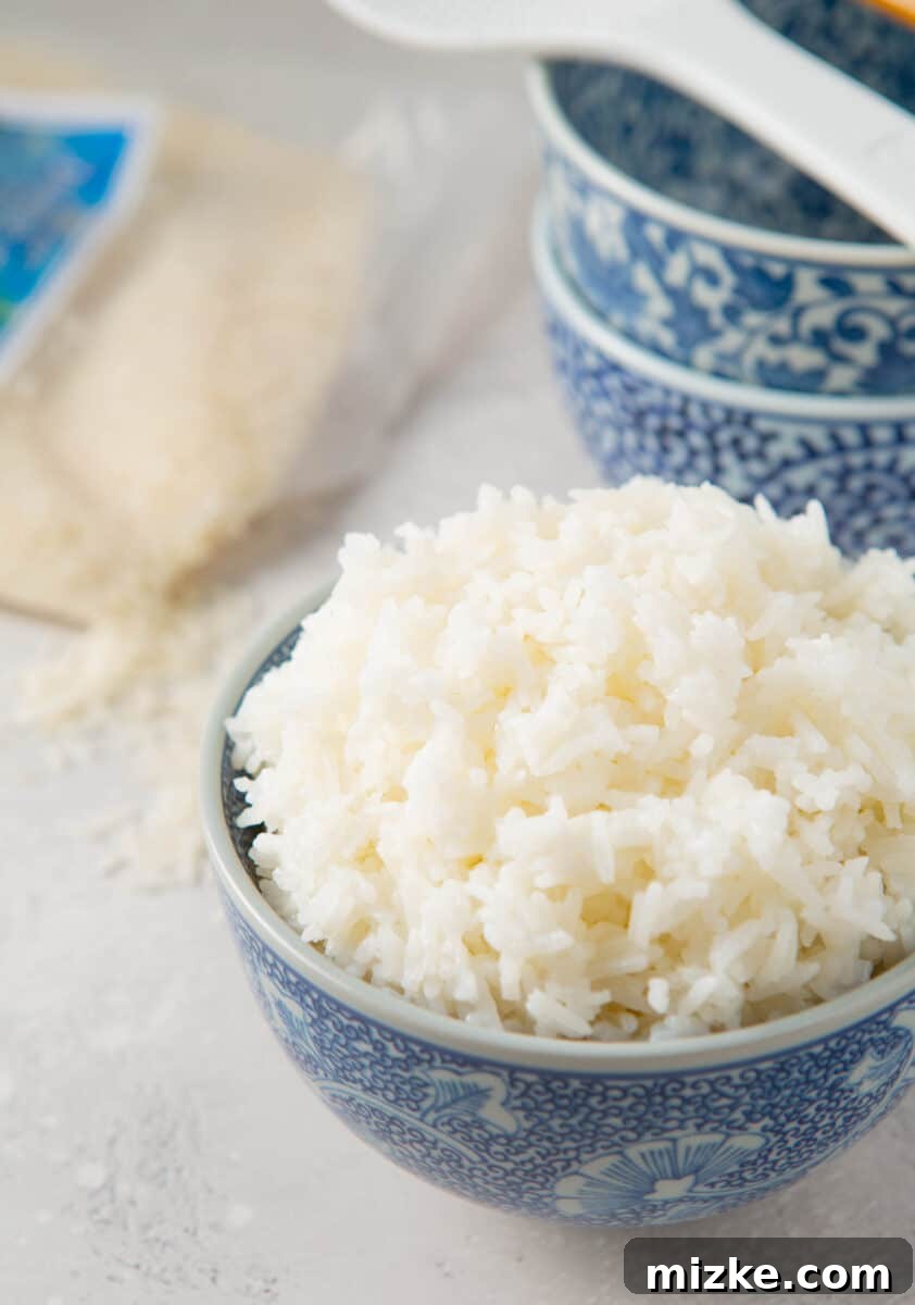 Perfect Instant Pot Jasmine Rice 8 Fluffy Instant Pot Jasmine rice served in an ornate blue bowl, ready to eat