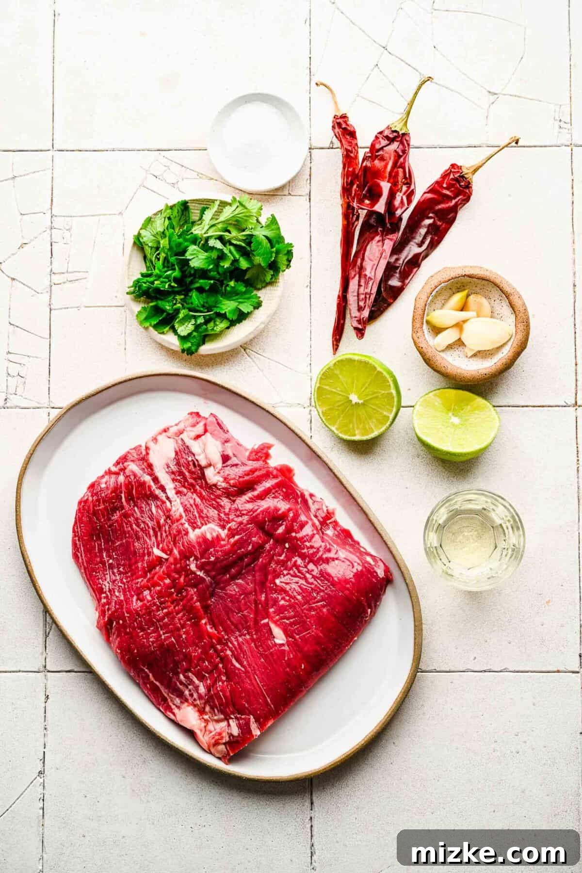 Bold Chipotle Guajillo Garlic Steak 4 Individual ingredients for garlic guajillo steak arranged neatly.