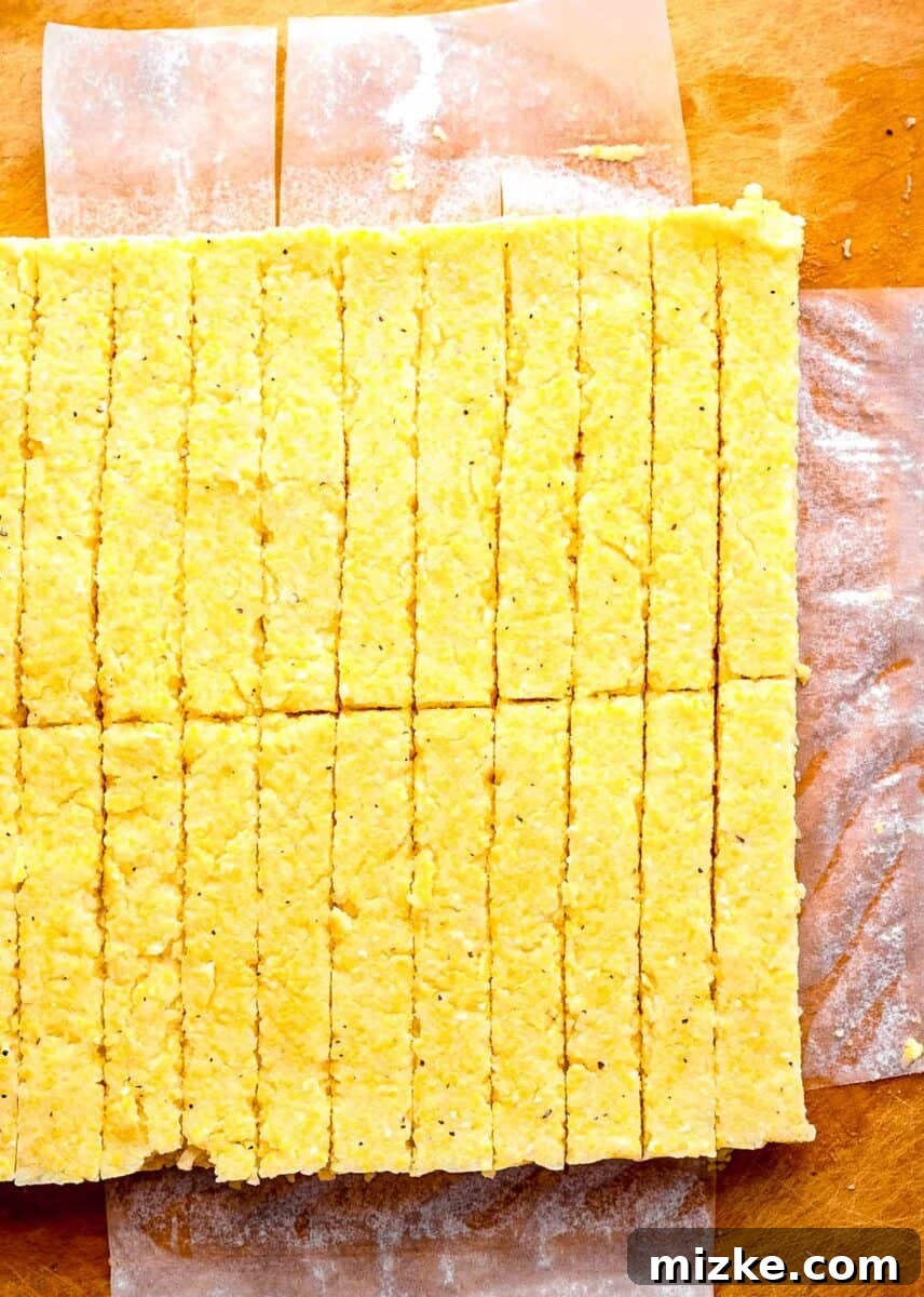 These polenta fries are made from cheesy polenta cut into strips, brushed with olive oil, and baked to crispy golden brown. Chilled polenta cup into strips.