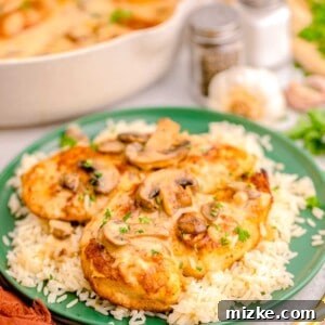 a green plate is topped with chicken marsala
