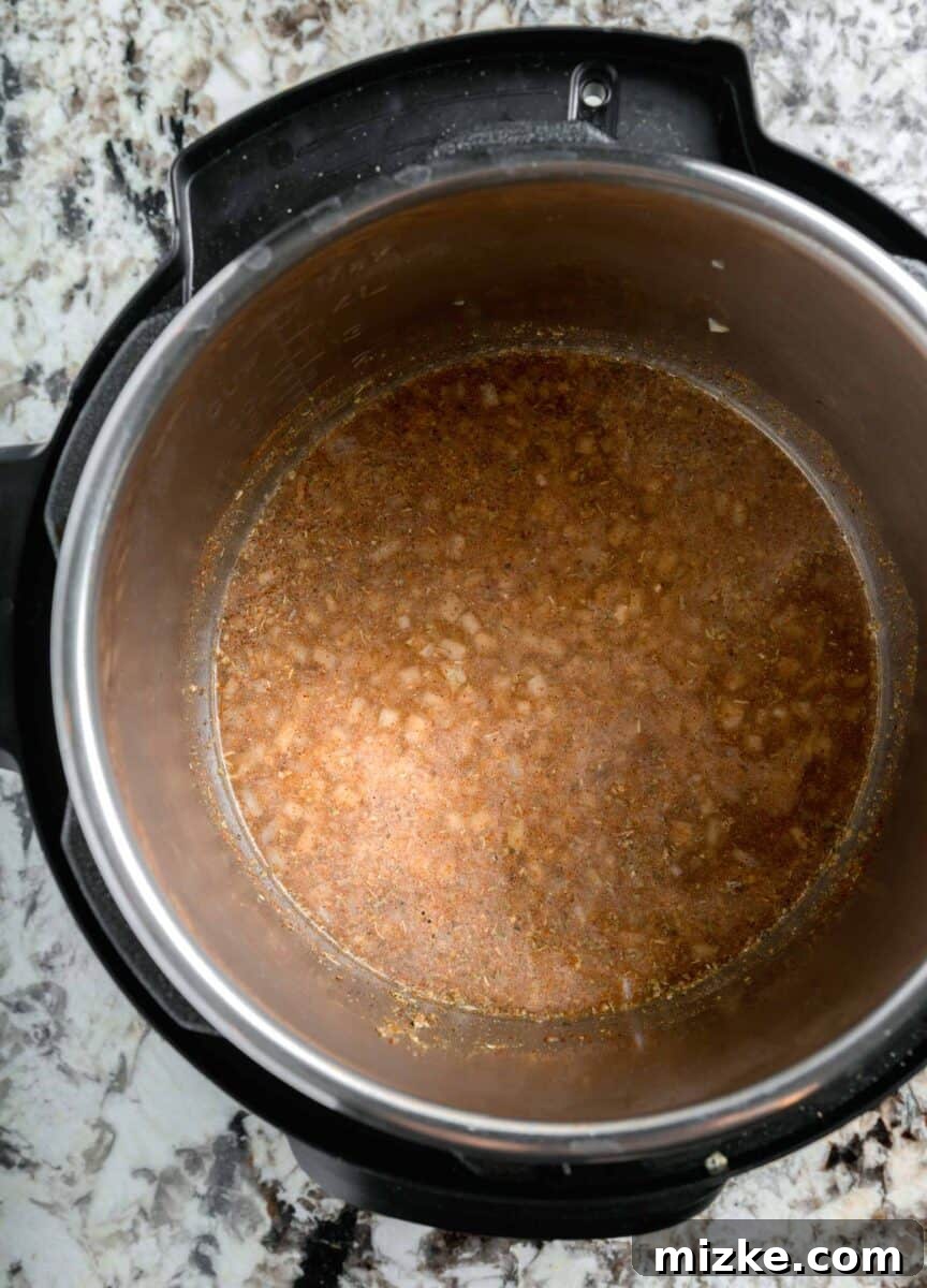 broth and seasonings added to the insert of an instant pot