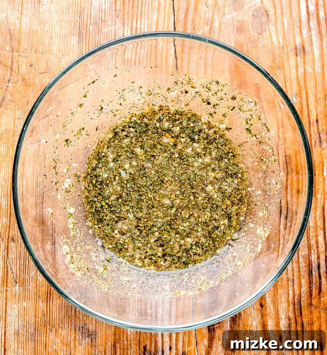 Greek seasoning mixed together in a clear bowl
