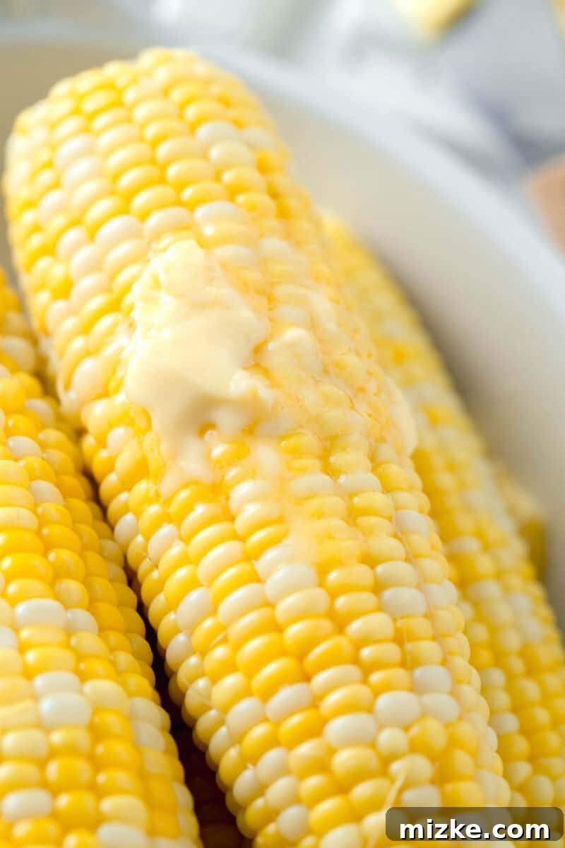Instant Pot Corn Perfection 5 melted butter on top of corn on the cob