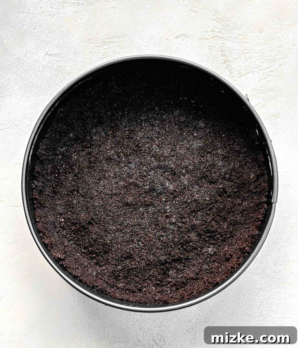 Oreo crust firmly pressed into the bottom and sides of a 9-inch springform pan.
