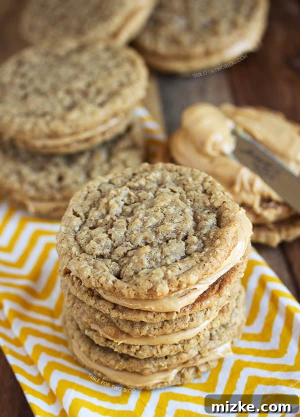 Irresistible Peanut Butter Sandwich Cookies A single Peanut Butter Sandwich Cookie bitten into, revealing the creamy peanut butter filling inside.