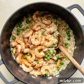 Creamy Shrimp Risotto 5 Stirring shrimp and peas into risotto.