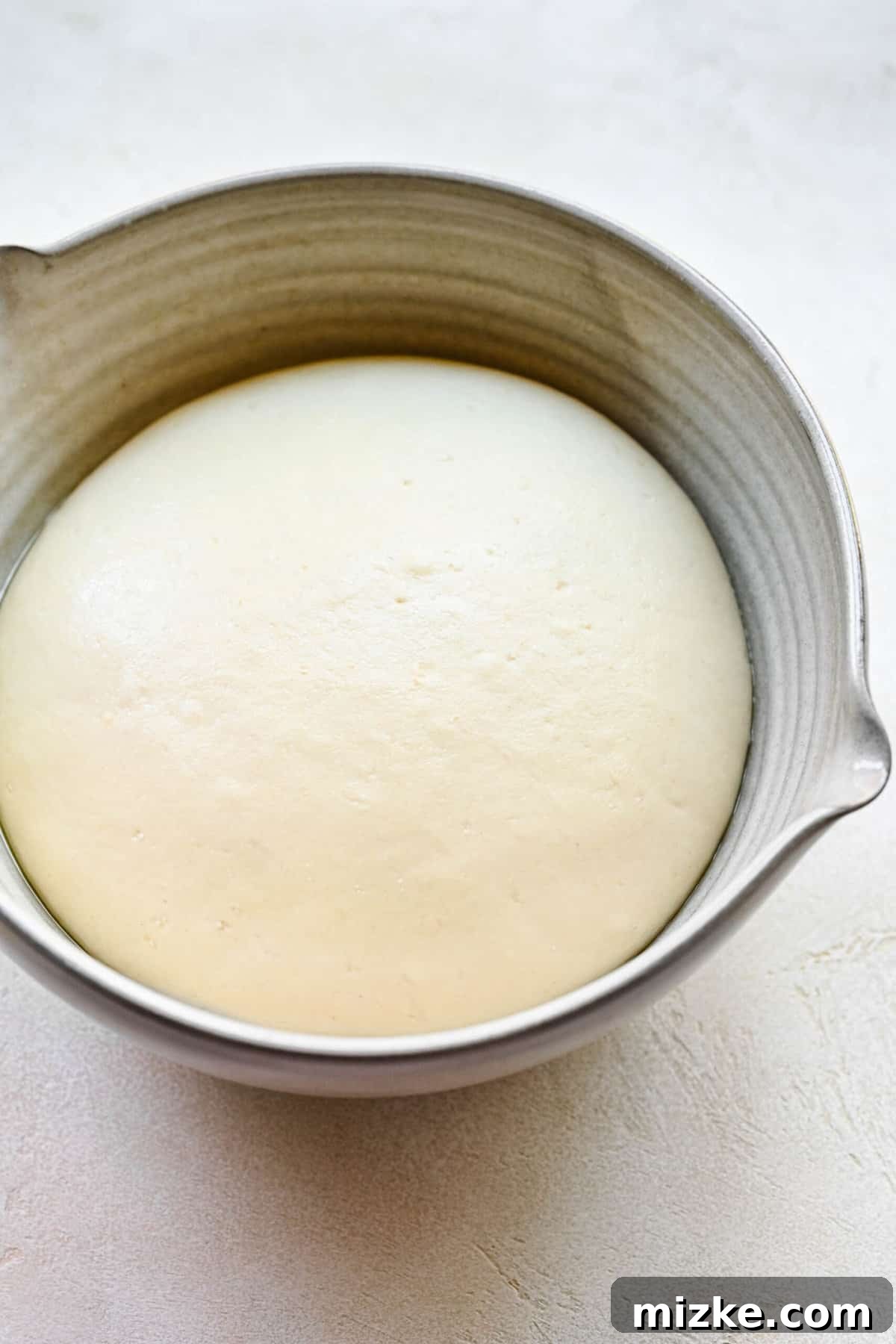 Bao bun dough after its first rise, doubled in size