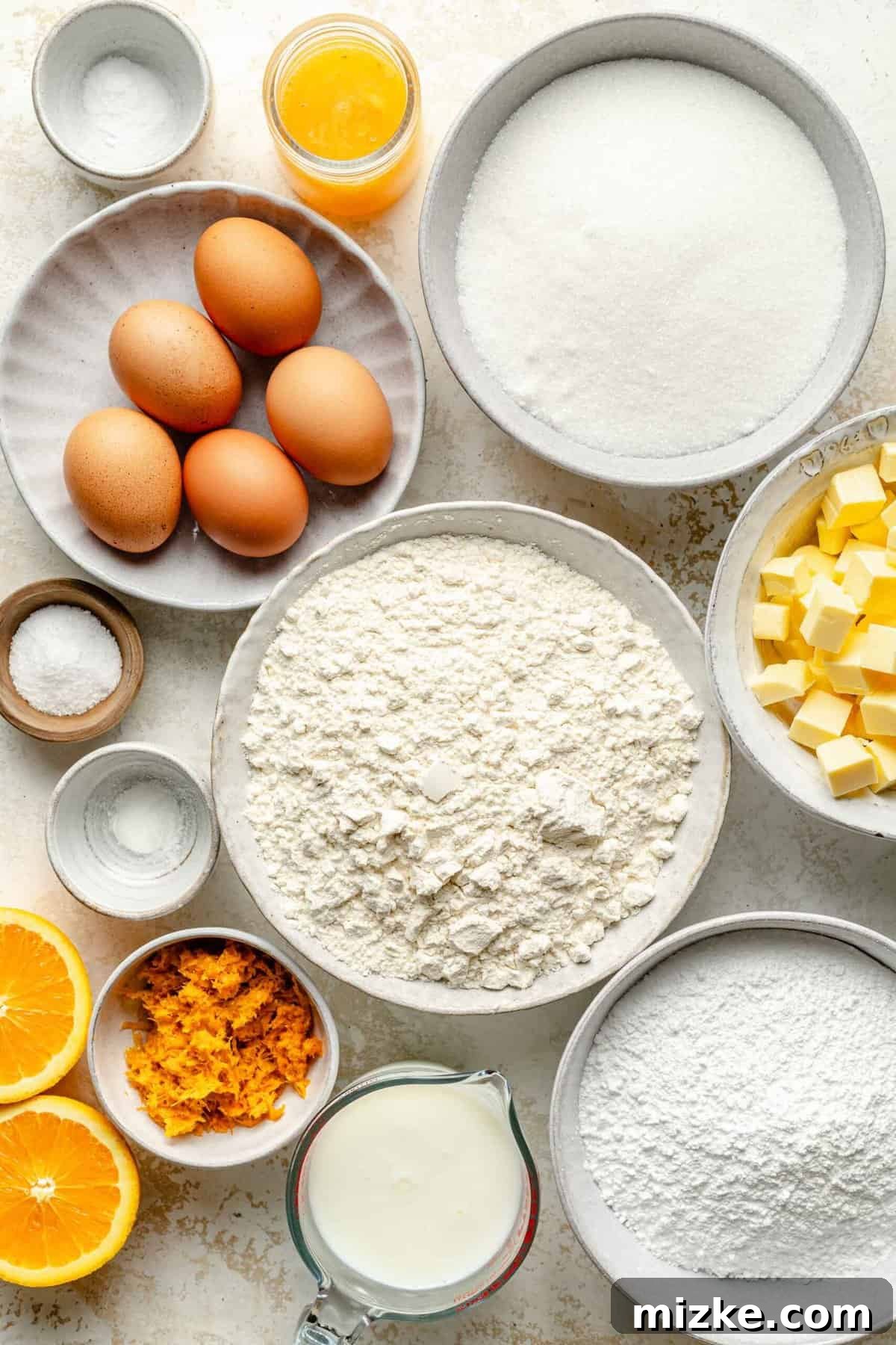 Gather your essential ingredients for a tender, buttery orange pound cake with a sweet orange glaze, guaranteed to be loaded with real, fresh orange flavor. A collection of fresh, high-quality ingredients laid out on a clean counter, including ripe oranges, creamy buttermilk, all-purpose flour, softened butter, and farm-fresh eggs, all ready for making the orange pound cake.