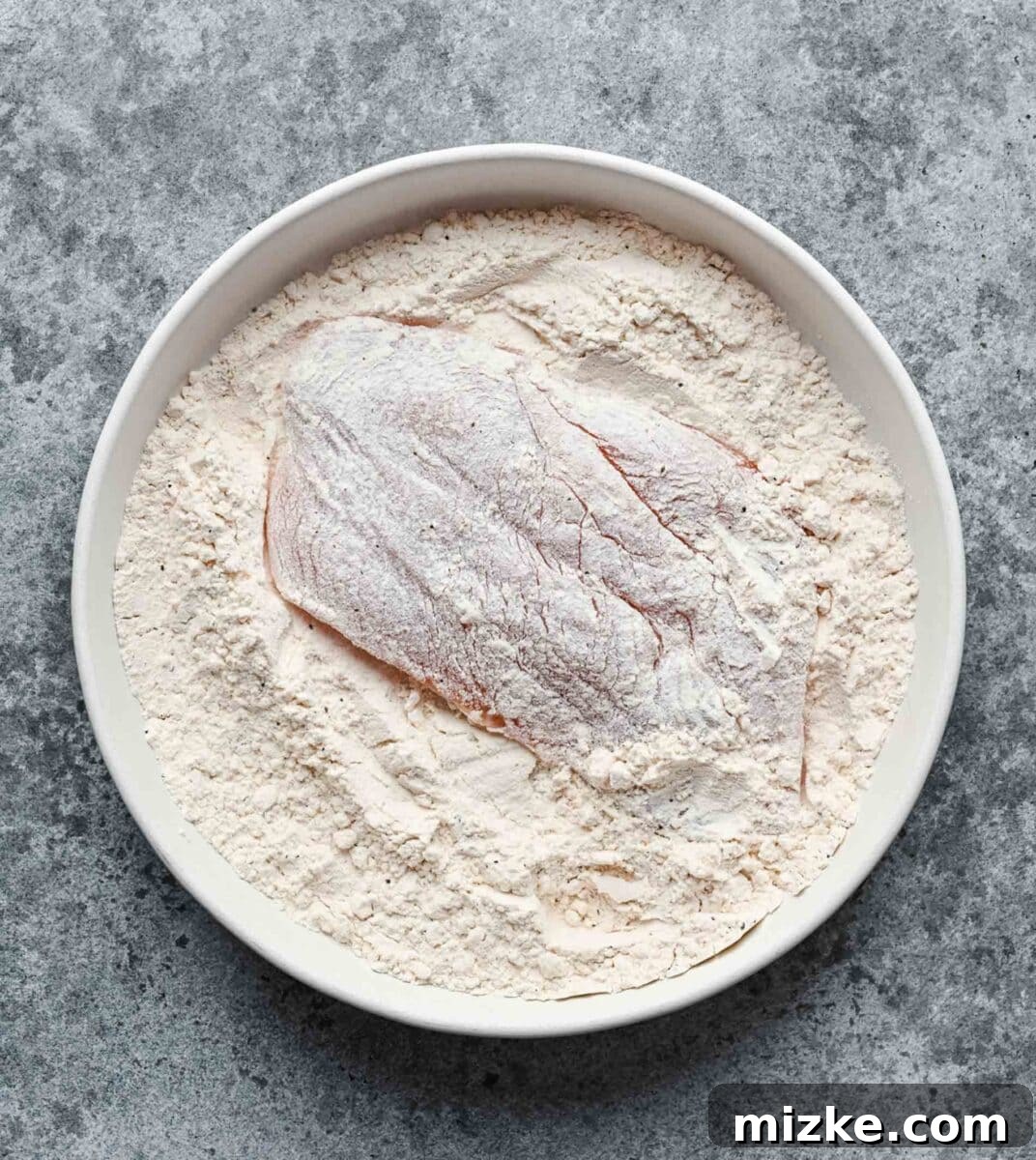 This easy chicken francese is made of tender chicken breast halves lightly breaded, pan-fried, and finished in a bright lemon-butter sauce. Dredging both sides of a chicken breast half in seasoned flour.