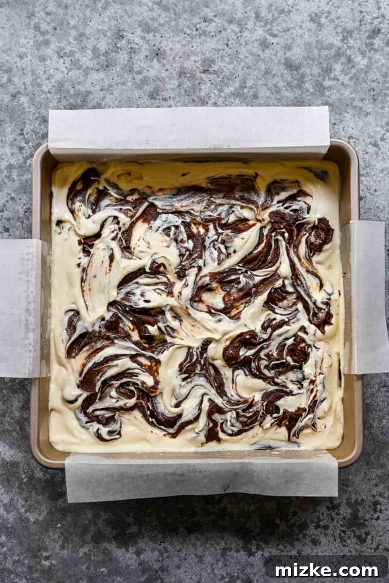 Cream cheese brownies assembled and ready to go in the oven.